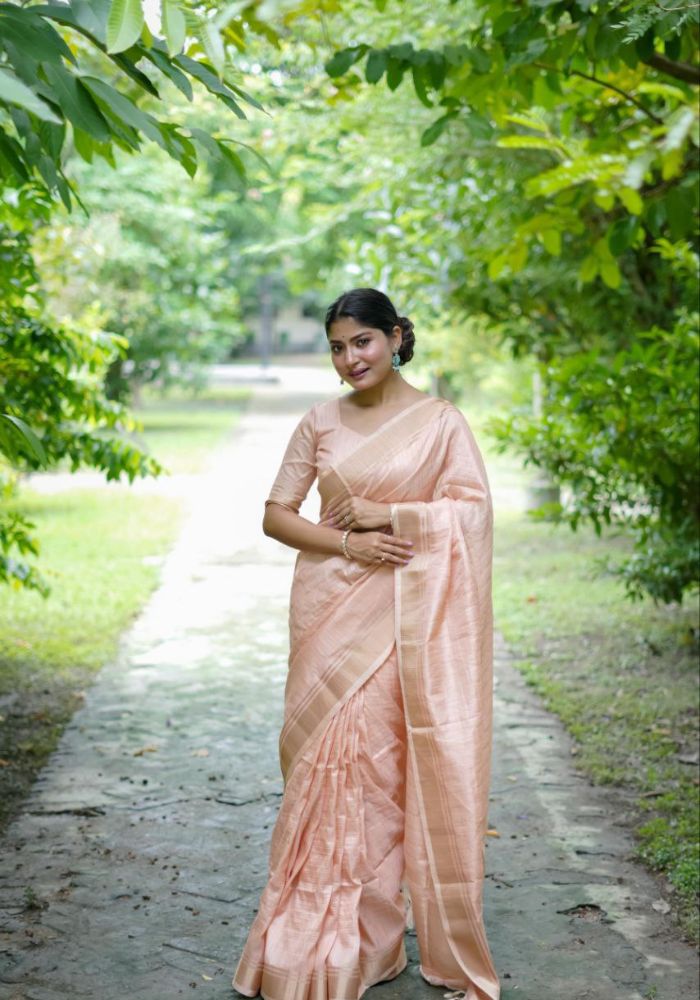 Delicate Peach Saree with Lustrous Finish and Gold Pallu