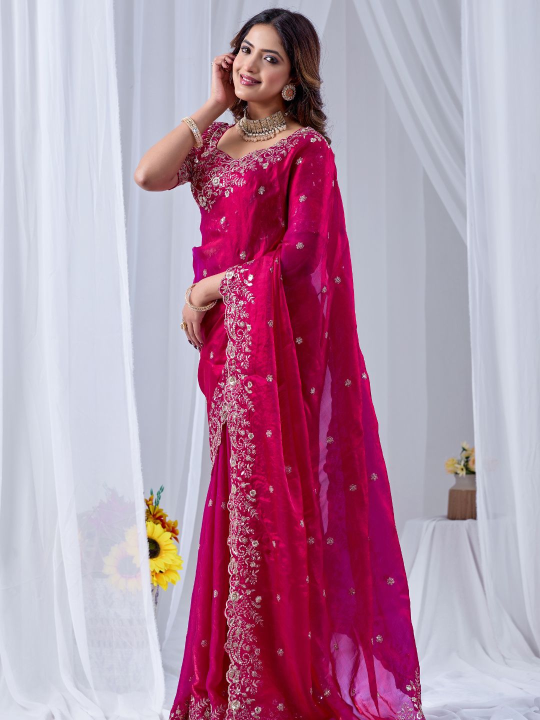 Fuchsia pink embroidered silk saree with designer blouse