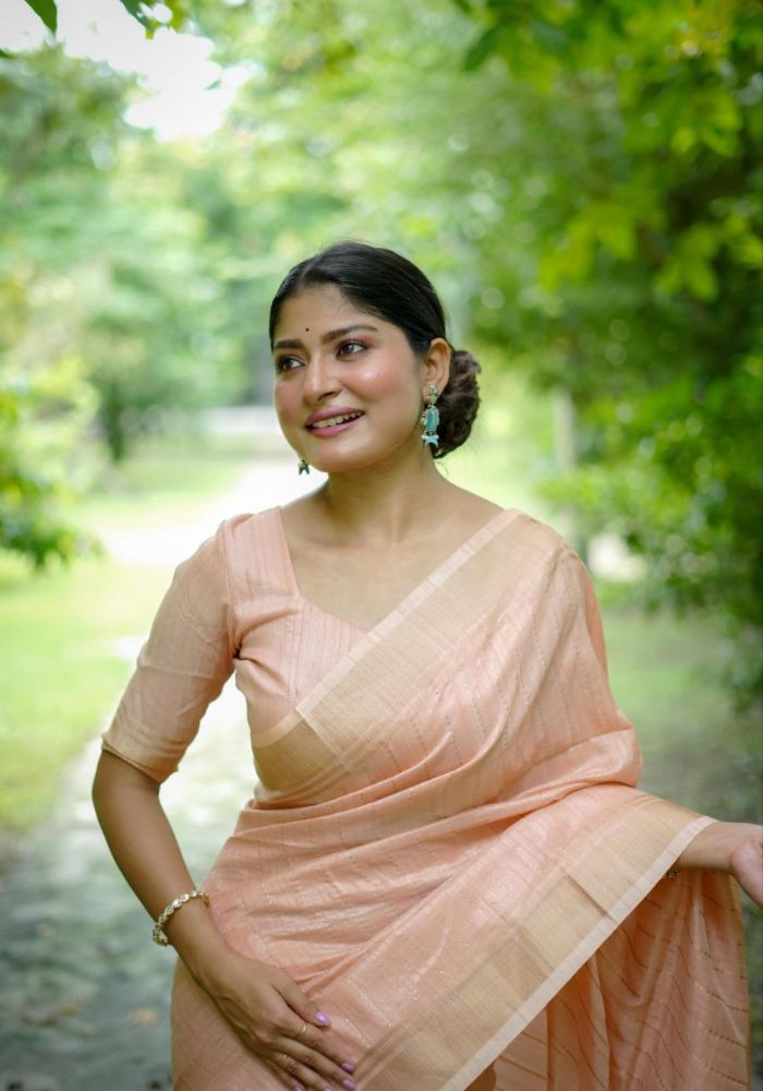 Delicate Peach Saree with Lustrous Finish and Gold Pallu