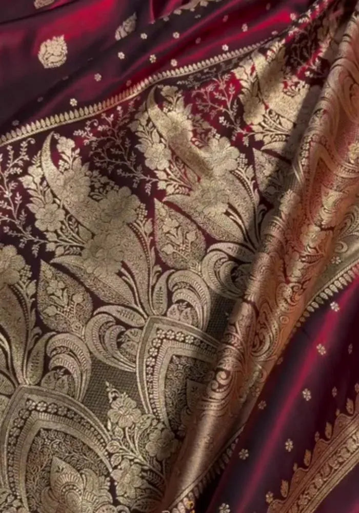 women maroon banarasi saree