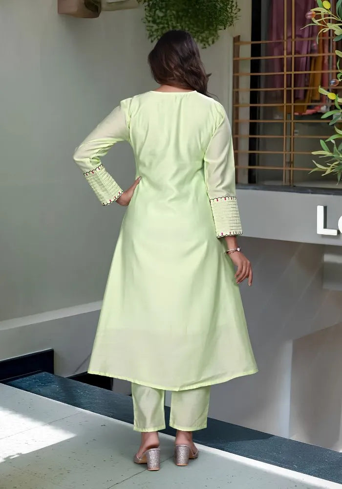 women pista green anarkali kurta set